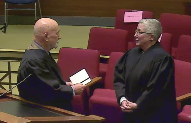 Former Presiding Justice Anthony Kline, left, administered the oath of office to Therese Stewart, the new presiding justice of the 1st District Court of Appeal's Division Two, which is based in San Francisco. Photo: Screengrab<br>