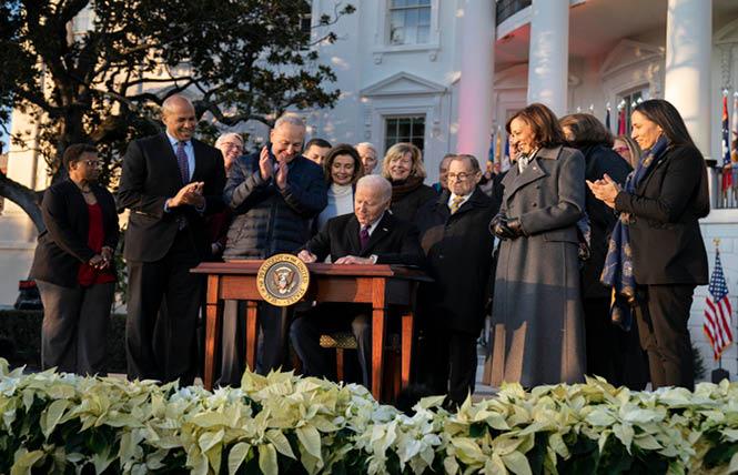President Joe Biden signs the Respect for Marriage Act on the South Lawn of the White House during a December 13 ceremony. Photo: Courtesy the White House