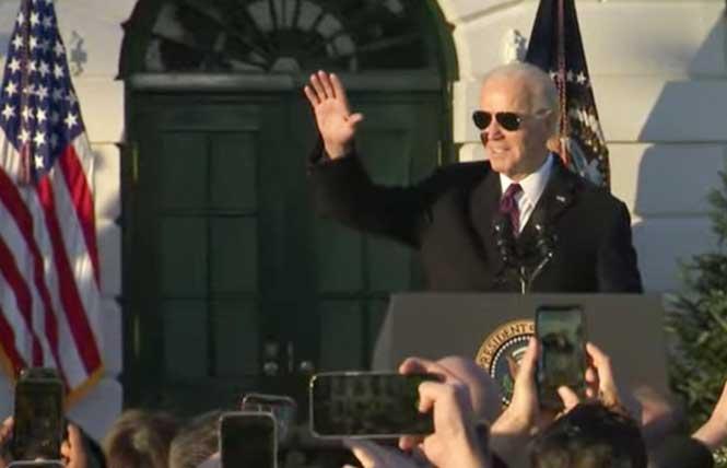 President Joe Biden acknowledges the crowd on the South Lawn of the White House shortly before signing the Respect for Marriage Act during a December 13 ceremony. Photo: Screengrab