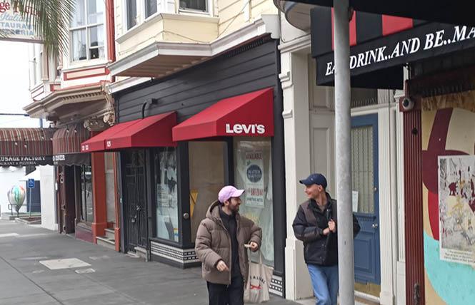 People walk past the old Levi's space at 525 Castro Street Friday, February 3. A pop-up is now planned for the storefront. Photo: Scott Wazlowski