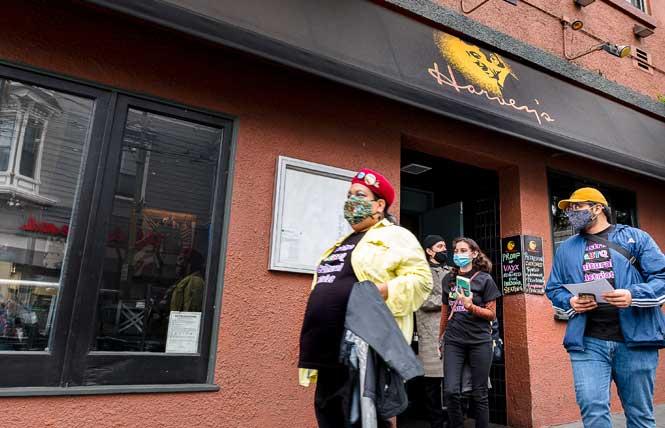 Tina Aguirre, left, manager for the Castro LGBTQ Cultural District, program associate Samuel Favela, in back, and SFSU sociology students Hanelye Mazariegos, center, and Alejandro Barrientos, right, left the now-closed Harvey's restaurant in the Castro on October 20, 2021 after collecting sexual orientation and gender identity data from the business as part of a volunteer program with the Castro LGBTQ Cultural District. Photo: Christopher Robledo