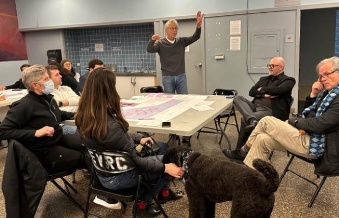 Marco Bass, standing, discusses the proposed renovation of the Eureka Valley Dog Play Area at a March 21 community meeting. Photo: Sari Staver<br> 