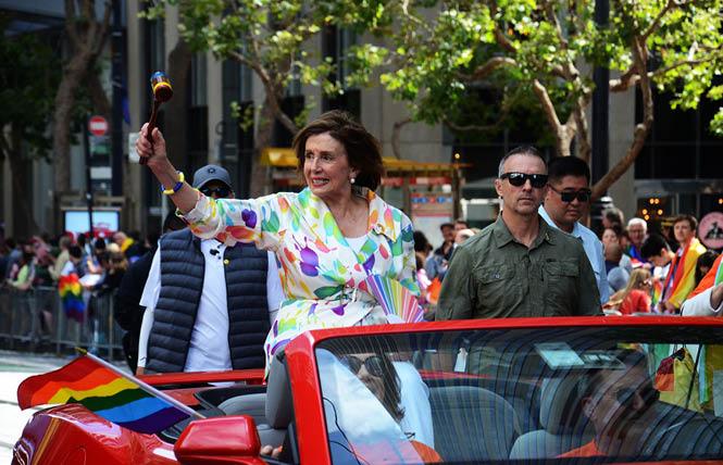 Then-House Speaker Nancy Pelosi (D-San Francisco) waves a gavel to the crowd at last year's San Francisco Pride parade. Photo: Rick Gerharter