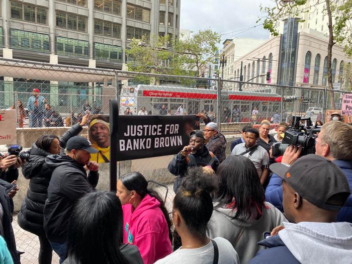 Xavier Davenport, center holding microphone, helped lead a community vigil for Banko Brown, who was allegedly killed by a Walgreens security guard April 27 in San Francisco. Photo: John Ferrannini