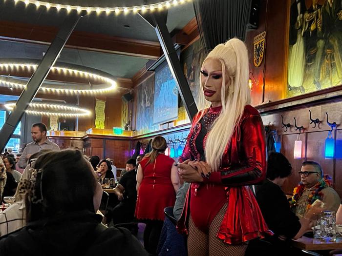 Drag artist Bobby Friday greets customers at Schroeder's June 1 during the first Drag Me Downtown event. Photo: Matthew S. Bajko