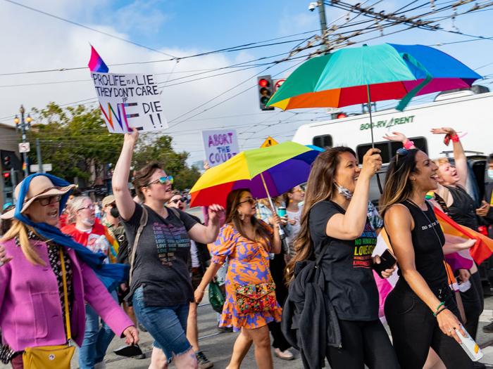 People carried signs and umbrellas during last year's Dyke March. Photo: Jane Philomen Cleland<br>