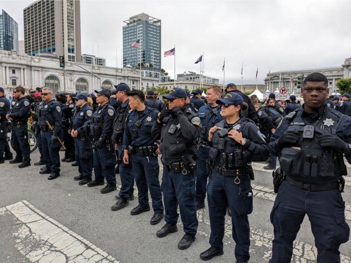 San Francisco police officers were out in force after receiving word that a man at the celebration at Civic Center Sunday had a gun. Photo: Charlie Hinton<br>