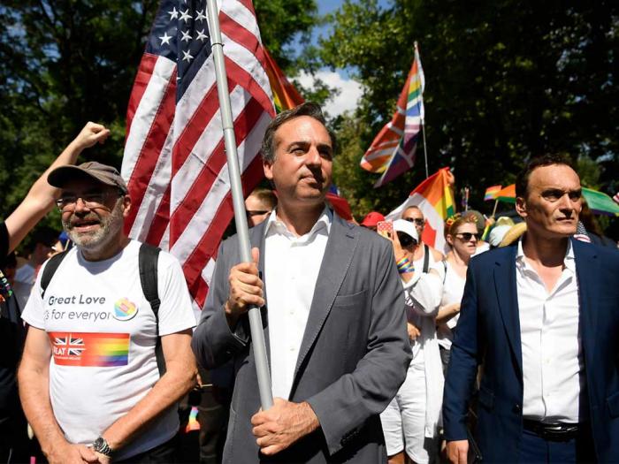 Gay United States Ambassador to Hungary David Pressman carried the American flag as he marched with thousands of Pridegoers in Budapest Pride on July 15. Photo: Tamas Kovacs/MTI via AP