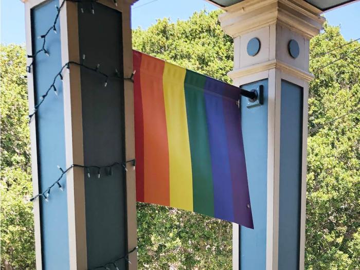 The rainbow banner in front of the Congregational Church of Belmont was vandalized sometime overnight July 18. Photo: Courtesy CCB