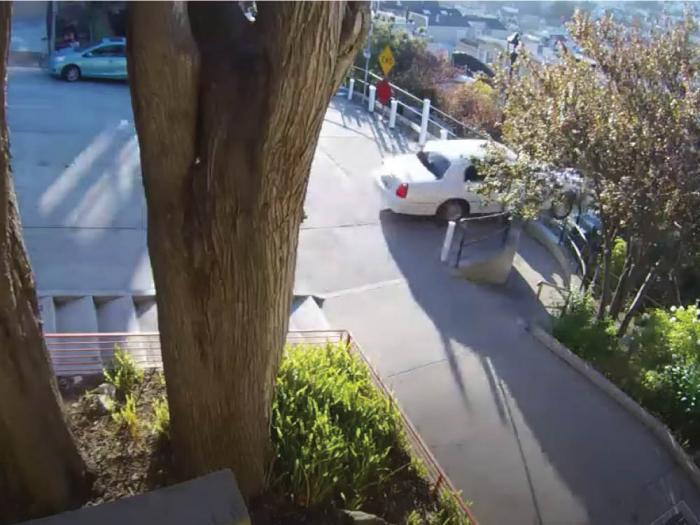 A car that was allegedly carjacked plummeted over the Sanchez Street stairs in the Castro July 22. Photo: Julia Brown's YouTube
