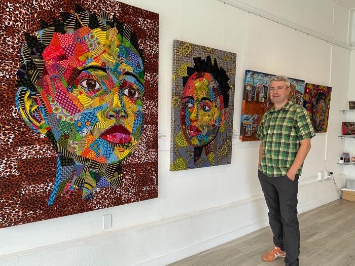 Art House SF owner Max Khusid with works by Tsholo Montong (photo: JL Odom)