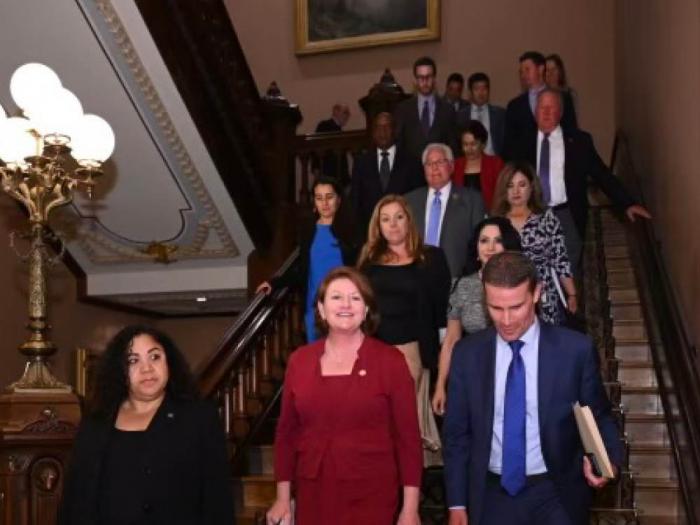 State Senate President pro Tempore Toni Atkins, center, walked down the stairs with her successor, pro tem designee Senator Mike McGuire, after the announcement was made August 28. Photo: Courtesy CA Senate Rules Photography/Jeff Walters