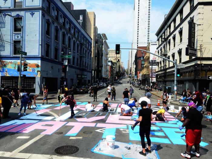 Several dozen volunteers painted a street mural "Black Trans Lives Matter" in August 2020 in the intersection of Turk and Taylor streets at the corner where Compton's Cafeteria was located in the Transgender District. Photo: Rick Gerharter<br>