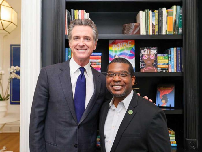 Governor Gavin Newsom, left, signed a bill by Assemblymember Corey A. Jackson, Ph.D. that prohibits book banning in California schools. Photo: Courtesy the Governor's office