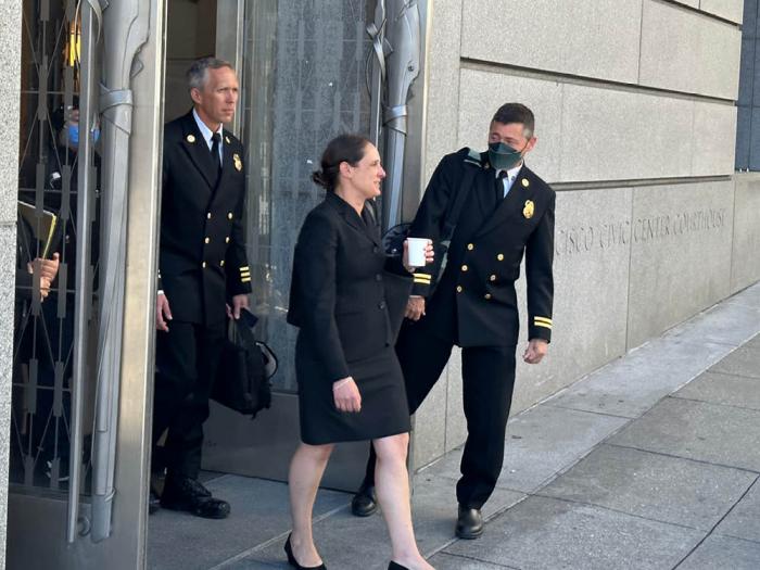 Deputy City Attorney Amy Frenzen leaves San Francisco Superior Court Thursday, accompanied by two San Francisco Fire Department officials. Photo: John Ferrannini