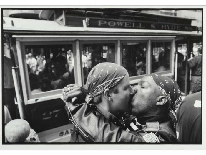 Andy Ilves and Tom Tymstone kiss during a Queer Nation kiss-in at the Powell Street cable car turnaround in 1990. Photo: Rick Gerharter Photographs Collection, SFPL