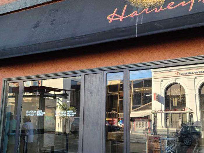 The bare windows of Harvey's at 18th and Castro streets still had the Lesbians Who Tech organization's tagline in the corner, but not the historic photos that Castro Street Seen had installed earlier this year. Photo: Cynthia Laird