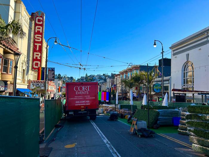 Fencing with green tarps was installed on Castro Street ahead of the Lesbians Who Tech & Allies Summit. Photo: Steven Bracco