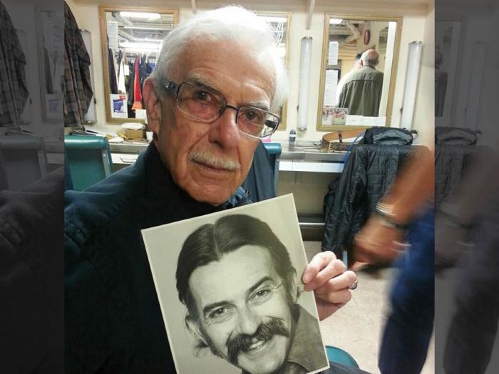 Milt Commons held one of his old acting headshots when he celebrated his 90th birthday while working backstage at San Francisco Opera. Photo: Tony Gorzycki