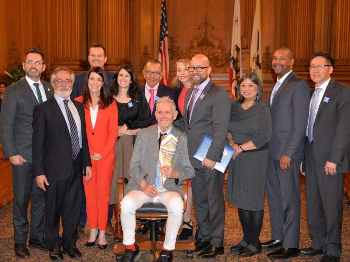 The Board of Supervisors in 2019 honored the late gay leader Harry Britt, seated, on the 40th anniversary of his appointment to the legislative body. Photo: Bill Wilson<br><br>