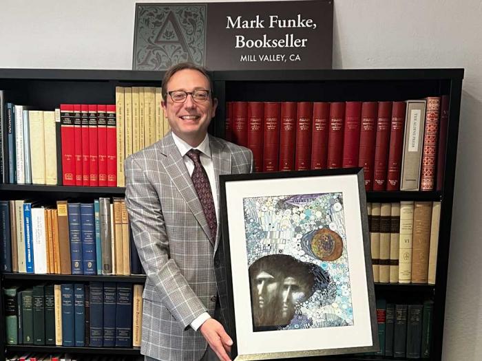 Mill Valley bookseller Mark Funke holds the original cover artwork for Ursula K. Le Guin's "The Left Hand of Darkness." Photo: Matthew S. Bajko
