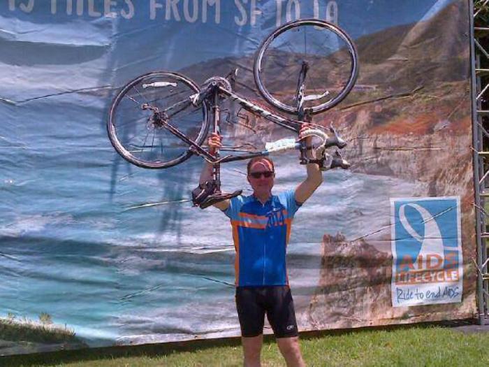Congressmember Adam Schiff held his bike aloft at the finish line of the AIDS/LifeCycle ride in 2014. Photo: From Congressmember Schiff's Facebook page