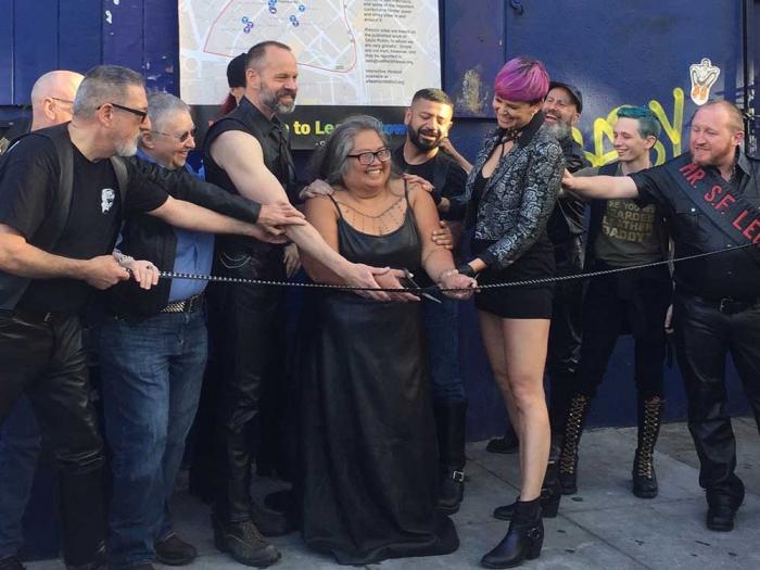 Rachele Sullivan, center, cut the ribbon outside the old Stud bar on June 12, 2018 to celebrate the designation of San Francisco's Leather and LGBTQ Cultural District. Photo: Liz Highleyman<br> 