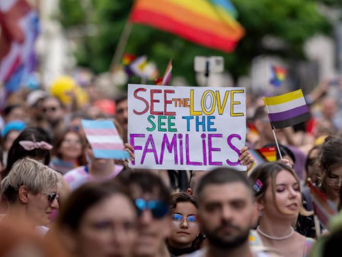 Pride marchers in the Czech Republic hold up a rainbow sign saying, "See the Love, See the Families," in 2023. Photo: Courtesy picture-alliance/dpa<br>
