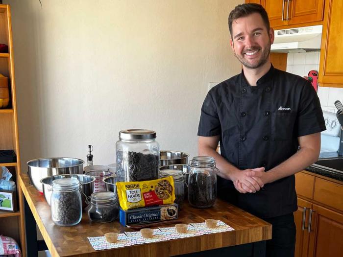 Brennan Bowen displays some of the chocolate he uses for his Golden Gate Cookie Co. Photo: Matthew S. Bajko