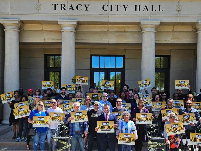 Dan Arriola, center, was surrounded by supporters in front of Tracy City Hall last month when he kicked off his mayoral campaign. Photo: Courtesy the candidate