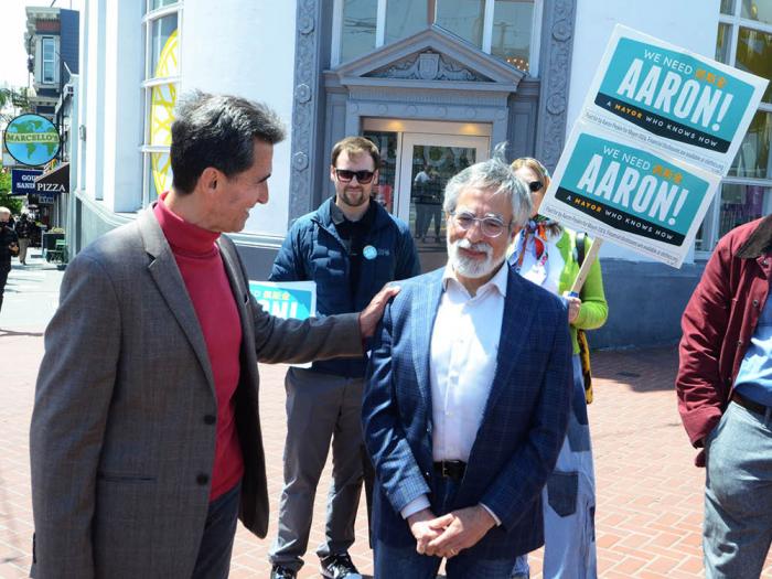 Former mayoral candidate and state lawmaker Mark Leno, left, greeted current mayoral candidate and Board of Supervisors President Aaron Peskin during a walking tour of the Castro May 18. Photo: Rick Gerharter<br>