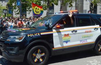 Pride groups grapple with police in parades