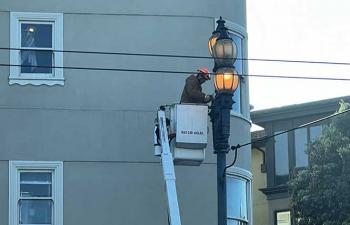 City workers repair Path of Gold lights